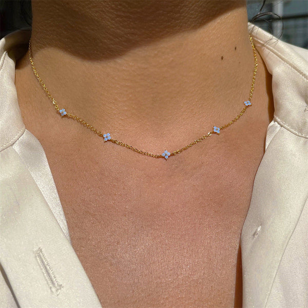Add a Touch of Elegance: The Tiny Blue Flower Necklace Every Woman Needs