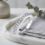 Moissanite Stack Ring Set – 2.0mm Round Brilliant Stones in Sterling Silver — lifestyle scene photograph
