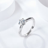 Close-up of 1 carat round moissanite stone with intense fire and clarity