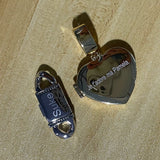 Lifestyle image of Cuban link ring worn on hand against denim fabric