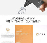 Overhead shot of rings beside rose gold watch and leather journal