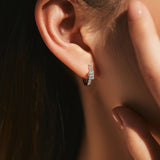 Close-up of moissanite stone setting and polished sterling silver surface detail