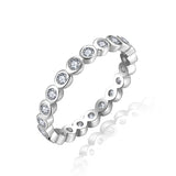 Lifestyle image of stackable rings worn on hand with neutral-toned outfit and natural lighting