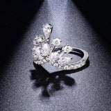 Side profile of crown-inspired stack ring highlighting geometric band and stone setting