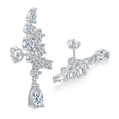 Lifestyle image of earrings worn on a model's ear with soft natural lighting and neutral backdrop