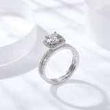 Close-up of round moissanite stone set in square band, highlighting brilliance