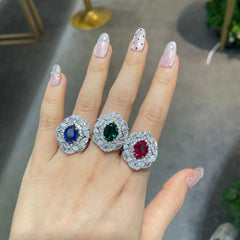Ring styled on hand against soft neutral fabric, highlighting wearability and modern proportion