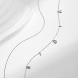 Side profile showing layered chain structure and pendant angle