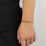 Front view of FITINY Cuban link hip hop bracelet in gold finish on white background