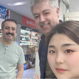 Bracelet on wrist with sleeve rolled up, natural lighting