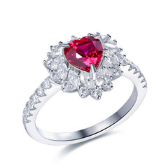 Front-facing studio shot of FITINY sterling silver heart ring with ruby center and moissanite accents on white background