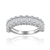 Side profile showing 3x5mm emerald-cut moissanite stone and slim sterling silver band