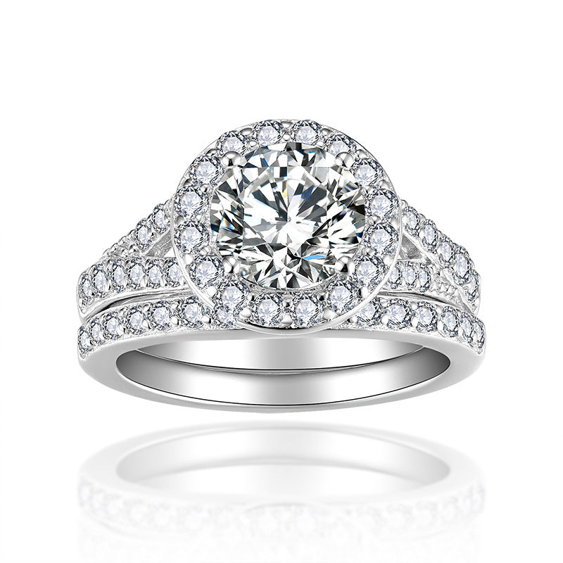Side profile showing geometric band and 7.5mm round moissanite center stone