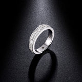 Side profile showing geometric band shape and 3EX-cut moissanite stone