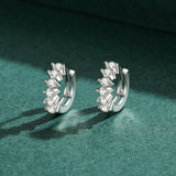 Pair of hoop earrings displayed together with soft shadow lighting