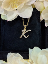 K letter pendant close-up focusing on precision engraving and stone alignment