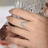 Close-up of micro-pave setting with three D-E grade moissanite stones in 18K gold plated sterling silver