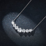 Necklace laid flat on neutral background highlighting smooth white gold plating and clean sterling silver chain