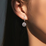 Side profile view highlighting the full-circle zirconia setting and smooth sterling silver curve