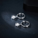 Rose gold teardrop earrings styled with minimalist necklace on model's ear