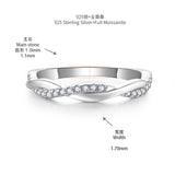 Side profile showing the elegant pear-shaped moissanite and slender sterling silver band