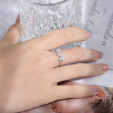 Side profile showing band thickness and stone alignment of white gold moissanite ring