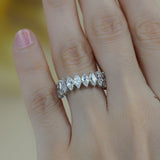 Side profile showing geometric band curvature and stone alignment