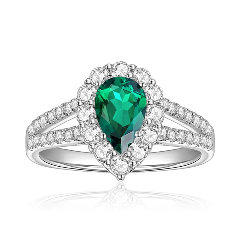 Front view of FITINY teardrop cultured emerald ring with moissanite accents on white background