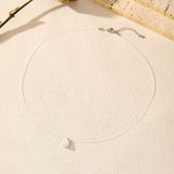 Model wearing the choker necklace highlighting collarbone fit and minimalist styling