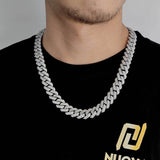 Gold Cuban chain necklace with natural lighting highlighting sparkle