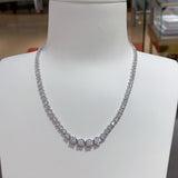 Macro shot highlighting precision stone setting and reflective white gold finish