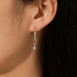 Close-up of round moissanite stone set in sterling silver bezel