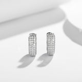 Top-down flat lay of earrings showcasing precise stone placement and clean metal finish