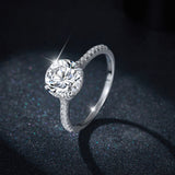 Lifestyle image of ring on desk with notebook and coffee, conveying everyday elegance