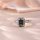 Close-up of vivid green moissanite center stone with precise emerald cut facets