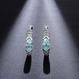 Close-up of moissanite stone detail highlighting 2EX cut and vibrant blue-green hue