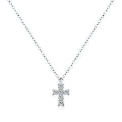 Close-up of pavé-set zirconia stones on minimalist cross pendant