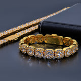Front view of gold ice sugar chain zirconia necklace and bracelet set on white background