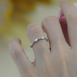 Ring styled alongside two minimalist stackable bands for layering inspiration