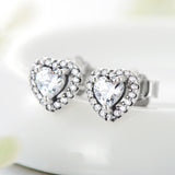 Close-up detail of micro-pavé zirconia stones on heart-shaped earring