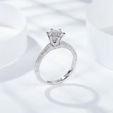 Side profile of moissanite ring highlighting white gold plated sterling silver band and stone depth