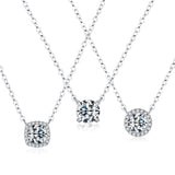 Top-down flat lay of solitaire moissanite necklace with chain draped