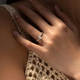 Side profile view of marquise moissanite ring showing band thickness and stone setting