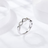 Close-up detail of 3EX cut oval moissanite with fire and clarity under natural light