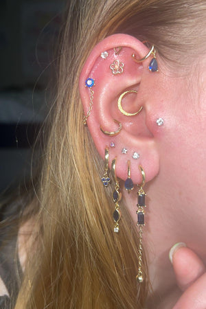 A girl wearing 6 Pieces Long Tassel Vintage stacked earring set