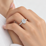 Elegant Oval D-Color VVS1 Moissanite Engagement Ring with Four-Prong Setting – worn by a woman, true-to-size [FITINY]