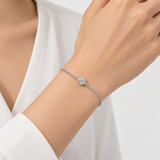 Minimalist Sterling Silver D-Color VVS1 Moissanite Solitaire Bracelet with Delicate Chain – worn by a woman, true-to-size [FITINY]