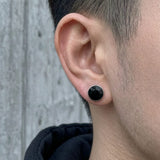Close-up of Multicolor Stainless Steel Magnetic Round Stud Earrings on ear