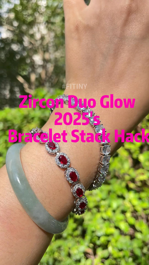 Empilement de bracelets avec halo de CZ rouges sur la main