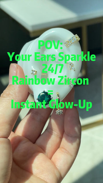 Rainbow Moissanite Studs on a Display Ear